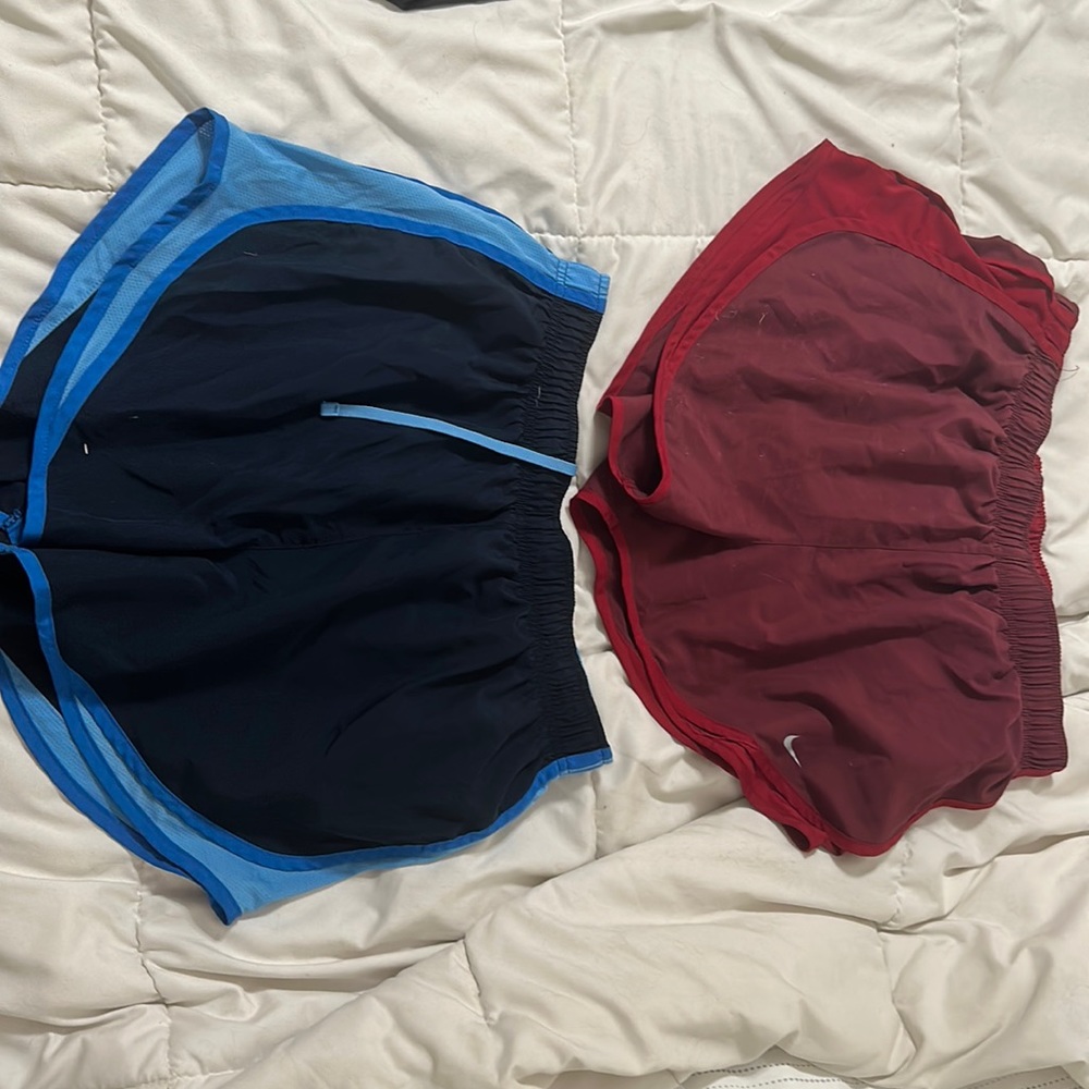 Two Nike women’s large running shorts with liner